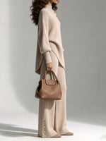 Two-piece Set Featuring A Comfortable Ribbed Knit Top With An Asymmetrical Hem And Matching Pants