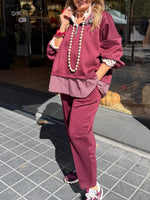 Chic Two-piece Set Featuring A Half-zip Sweatshirt With Mixed Plaid Paneling And Matching Pants.